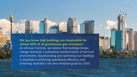 Image with green house gases text and buildings in background