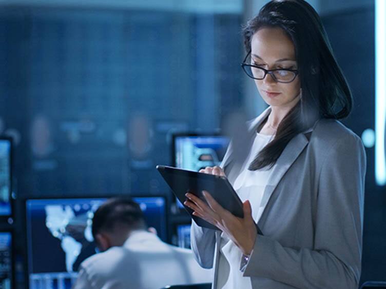 A woman using a tab in an office