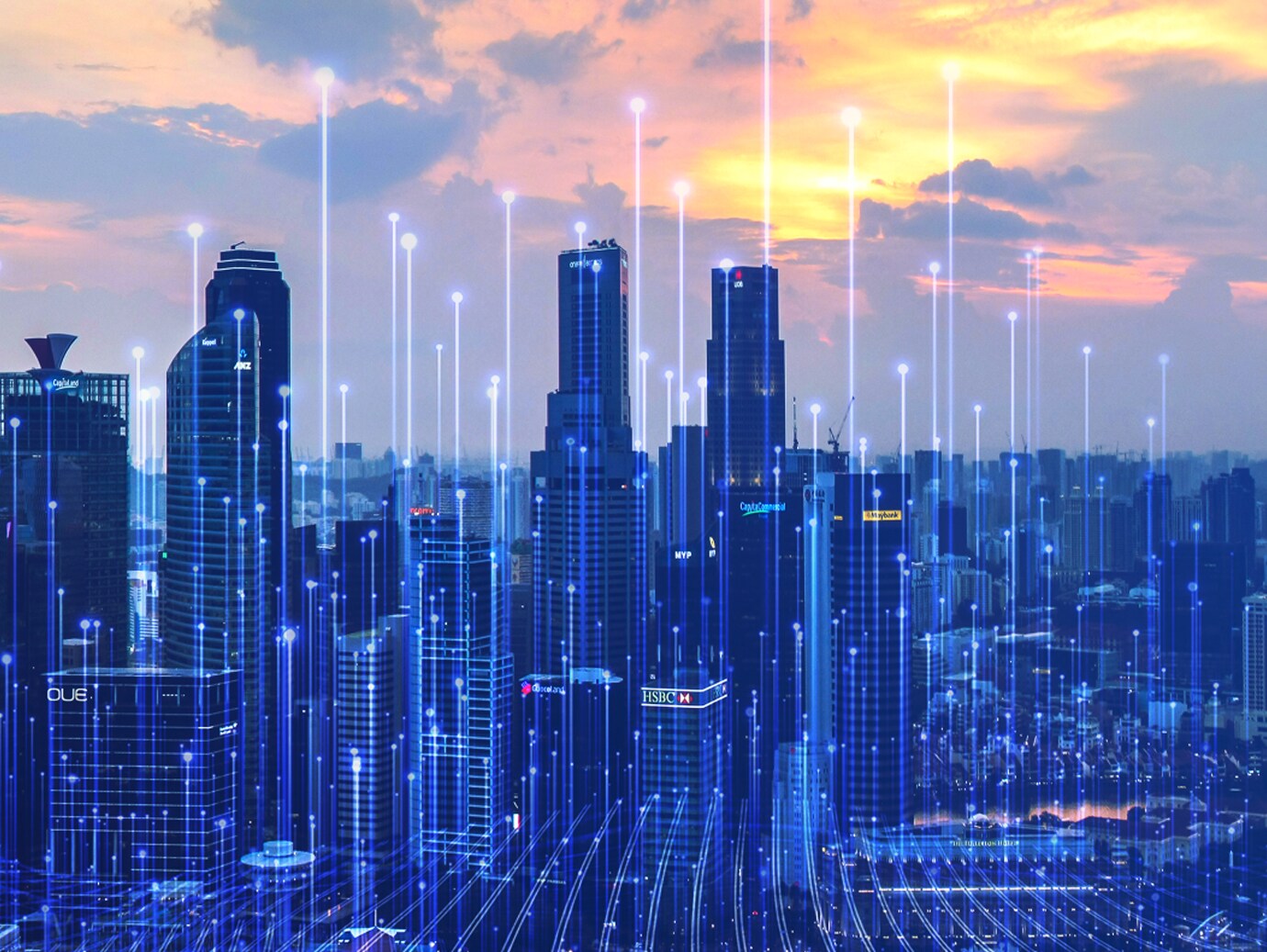 A cityscape at dusk with graphics